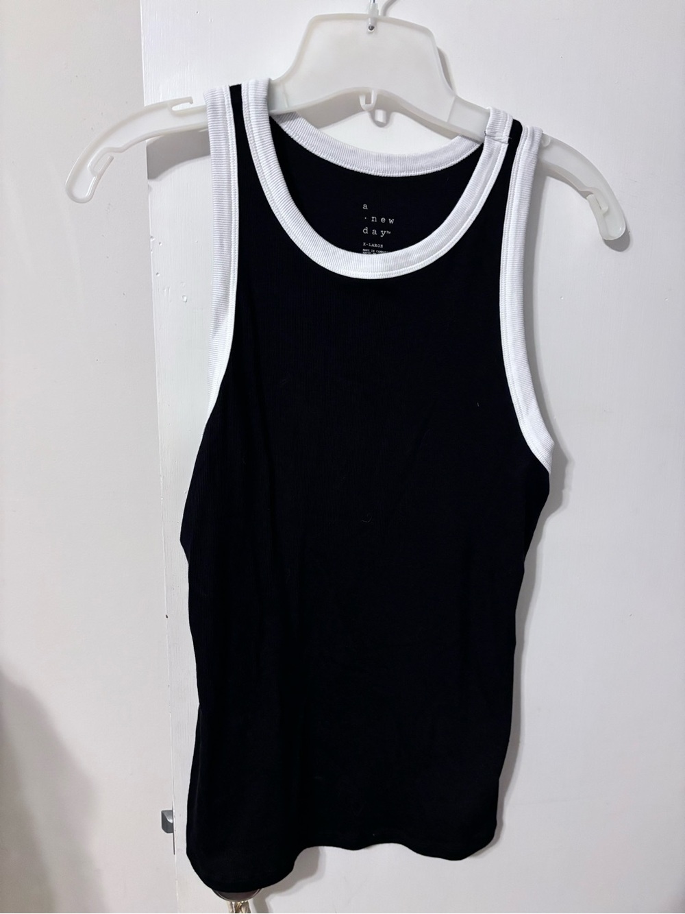 Women’s black tank with white trim. A new day brand
